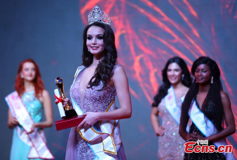 The contestant from Russia poses after winning first place in the world final of the 53rd Miss All Nations in Nanjing City, Jiangsu Province, Jan. 29, 2019. The pageant with the theme of eco-tourism included components of evening dress, bikini and national costumes. Participants from Russia, Mexico and Vietnam won the top three places. (Photo: China News Service/Yang Bo)