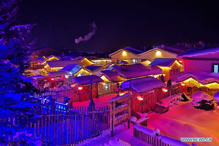 Photo taken by mobile phone shows the night view of Shuangfeng Forest Farm in Mudanjiang City, northeast China\'s Heilongjiang Province, Jan. 30, 2019. The Shuangfeng Forest Farm witnesses frequent snowfalls and is covered with snow for most of the year. The beautiful snow scenery here attracts many visitors from at home and abroad every year. (Xinhua/Yang Siqi)