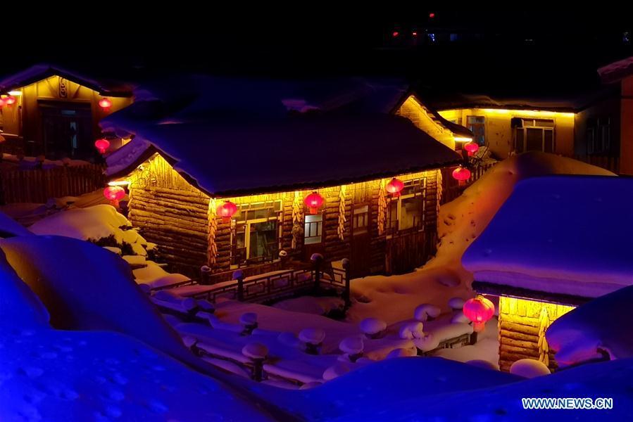 Photo taken by mobile phone shows the night view of Shuangfeng Forest Farm in Mudanjiang City, northeast China\'s Heilongjiang Province, Jan. 30, 2019. The Shuangfeng Forest Farm witnesses frequent snowfalls and is covered with snow for most of the year. The beautiful snow scenery here attracts many visitors from at home and abroad every year. (Xinhua/Yang Siqi)