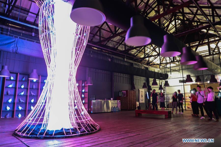 Visitors view TOTEM light installation during the Bangkok Design Week 2019 in Bangkok, Thailand, Jan. 30, 2019. The Bangkok Design Week 2019 was held under the theme \