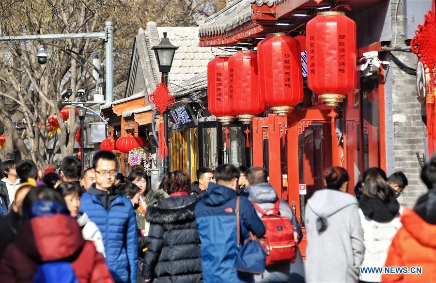 Tourists visit Nanluogu Alley in a festive atmosphere in Beijing, capital of China, Feb. 1, 2019. The city is decorated to greet the coming Chinese Lunar New Year, which falls on Feb. 5 this year. (Xinhua/Li Xin)