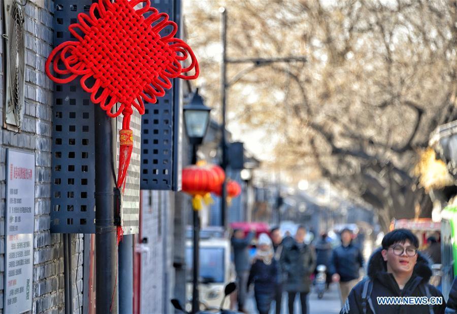 Chinese knot and lanterns are hung on a street to create a festive atmosphere at Maoer Hutong, a traditional alley, in Beijing, capital of China, Feb. 1, 2019. The city is decorated to greet the coming Chinese Lunar New Year, which falls on Feb. 5 this year. (Xinhua/Li Xin)