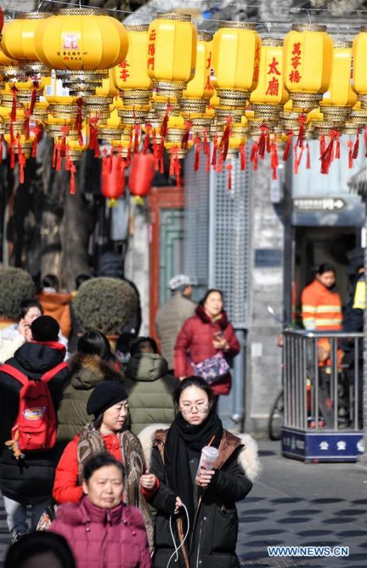 Tourists visit Nanluogu Alley in a festive atmosphere in Beijing, capital of China, Feb. 1, 2019. The city is decorated to greet the coming Chinese Lunar New Year, which falls on Feb. 5 this year. (Xinhua/Li Xin)