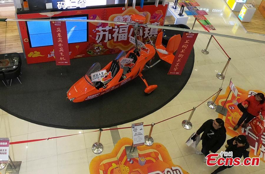 An autogyro, also known as a gyroplane, is on sale at a shopping mall in Shanghai, Feb. 2, 2019, ahead of the Spring Festival. The rotorcraft can fly at a maximum speed of 156 kilometers per hour and has a price tag of 691,800 yuan ($103,000). The mall is promoting it as the most expensive Lunar New Year gift. (Photo: China News Service/Zhang Hengwei)