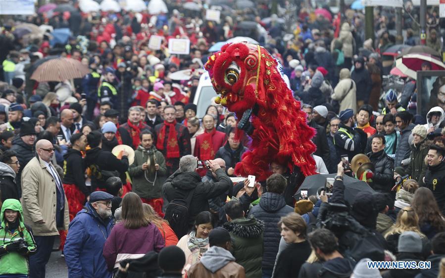 People take part in the 2019 Spring Festival parade in downtown Antwerp, Belgium, on Feb. 2, 2019. A long parade was held in the Belgian city of Antwerp on Saturday as part of the 2019 Spring Festival organized by the local Chinese community and Antwerp to mark the beginning of the Chinese New Year. (Xinhua/Ye Pingfan)