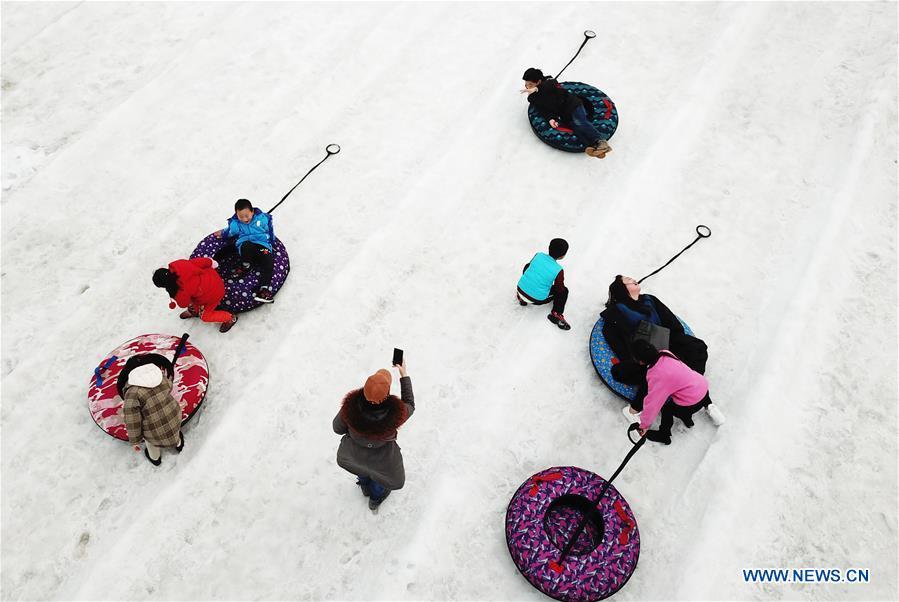 Aerial photo taken on Feb. 6, 2019 shows people enjoying themselves at an ice-snow amusement park in Punan Township of Lianyungang City, east China\'s Jiangsu Province. Many enthusiasts enjoy skiing as a way to celebrate the Spring Festival. (Xinhua/Geng Yuhe)
