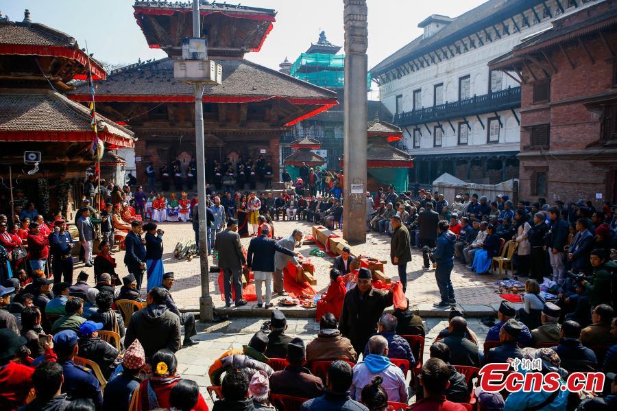 People carry wooden pillars for erection at the reconstruction site of the Kasthamandap temple at Hanumandhoka Durbar Square in Kathmandu, Nepal, Feb. 10, 2019. A ceremony was held to keep the wooden pillars to reconstruct the Kasthamandap temple, which was destroyed during the 2015 earthquake. Kasthamandap (Kastha: wood, mandap: pavilion) temple is one of the oldest and historical building in Kathmandu. (Photo: China News Service/Pu Ladan)