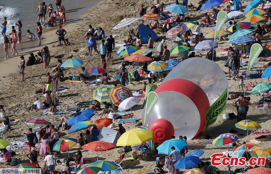 A giant plastic bottle is seen on a beach as part of a campaign by Greenpeace to warn of the presence of plastics on the coasts of Vina del Mar, Chile, Feb. 9, 2019. The campaign aims to end the flow of plastic into the oceans. (Photo/VCG)