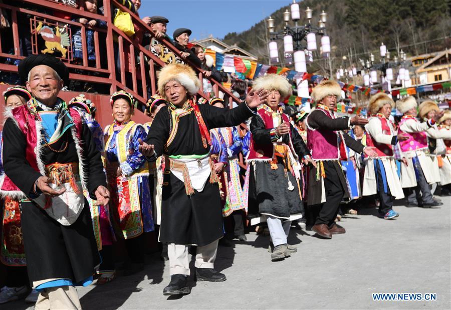 People of Tibetan ethnic group perform during the Shangjiu Festival at the foot of Jiajin Mountain in the Tibetan Township of Qiaoqi in Ya\'an City, southwest China\'s Sichuan Province, Feb. 13, 2019. The Shangjiu Festival, a traditional festival of the Tibetan people, is celebrated on the ninth day of the first lunar month to pray for a good harvest. (Xinhua/Jiang Hongjing)