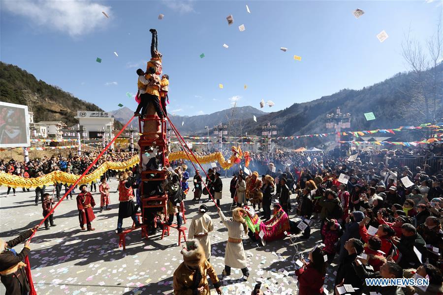 People of Tibetan ethnic group perform during the Shangjiu Festival at the foot of Jiajin Mountain in the Tibetan Township of Qiaoqi in Ya\'an City, southwest China\'s Sichuan Province, Feb. 13, 2019. The Shangjiu Festival, a traditional festival of the Tibetan people, is celebrated on the ninth day of the first lunar month to pray for a good harvest. (Xinhua/Jiang Hongjing)