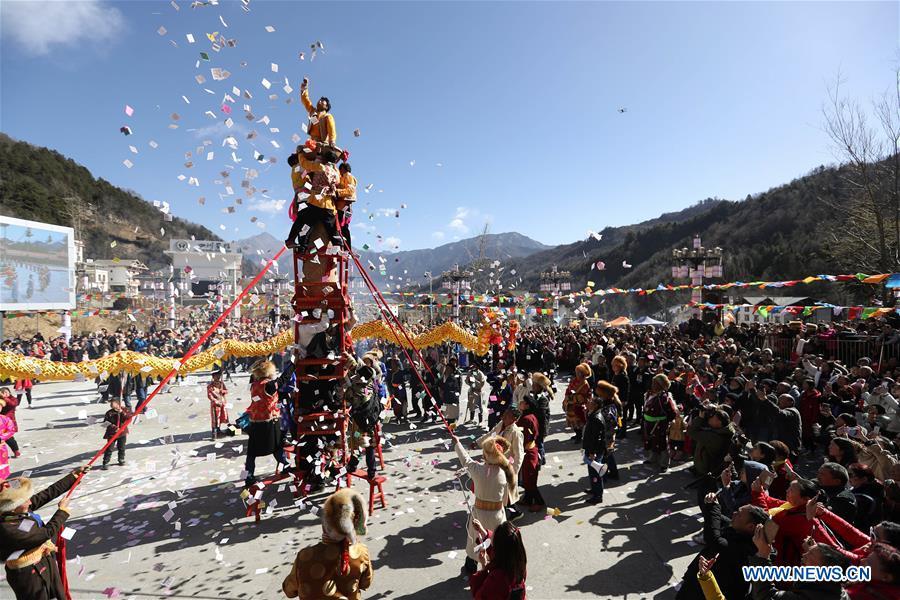People of Tibetan ethnic group perform during the Shangjiu Festival at the foot of Jiajin Mountain in the Tibetan Township of Qiaoqi in Ya\'an City, southwest China\'s Sichuan Province, Feb. 13, 2019. The Shangjiu Festival, a traditional festival of the Tibetan people, is celebrated on the ninth day of the first lunar month to pray for a good harvest. (Xinhua/Jiang Hongjing)