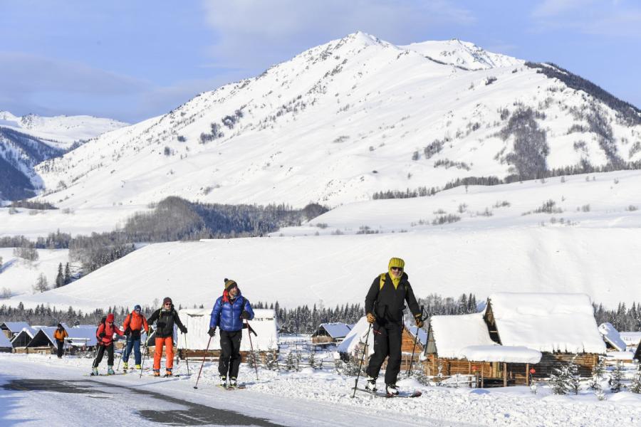 Skiers enjoying their time in Hemu, Xinjiang. (Photo/Xinhua)
For these experienced ski lovers on modern skis, such ancient fur skis gave them a glimpse of the wisdom of local ancestors.

Nowadays, despite the world adopting modern snowsports equipment, villagers in Hemu still use fur skis to preserve traditions.