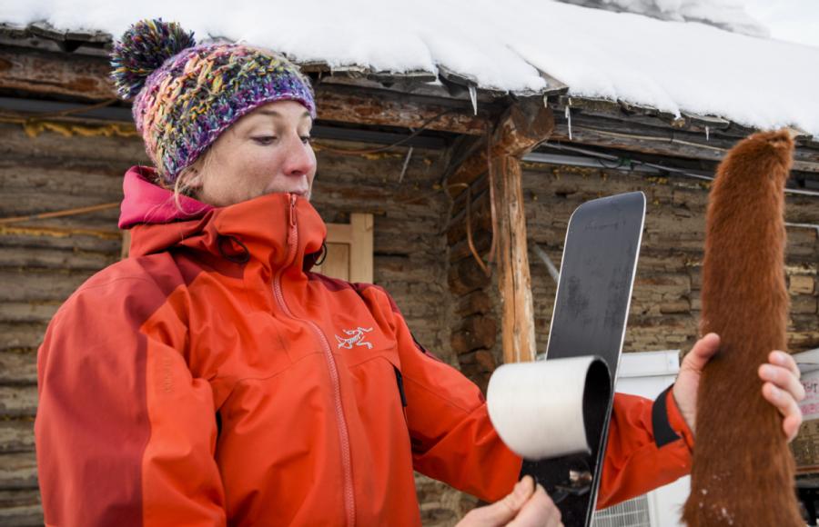 A French skier compares ancient fur skis with modern skis. (Photo/Xinhua)