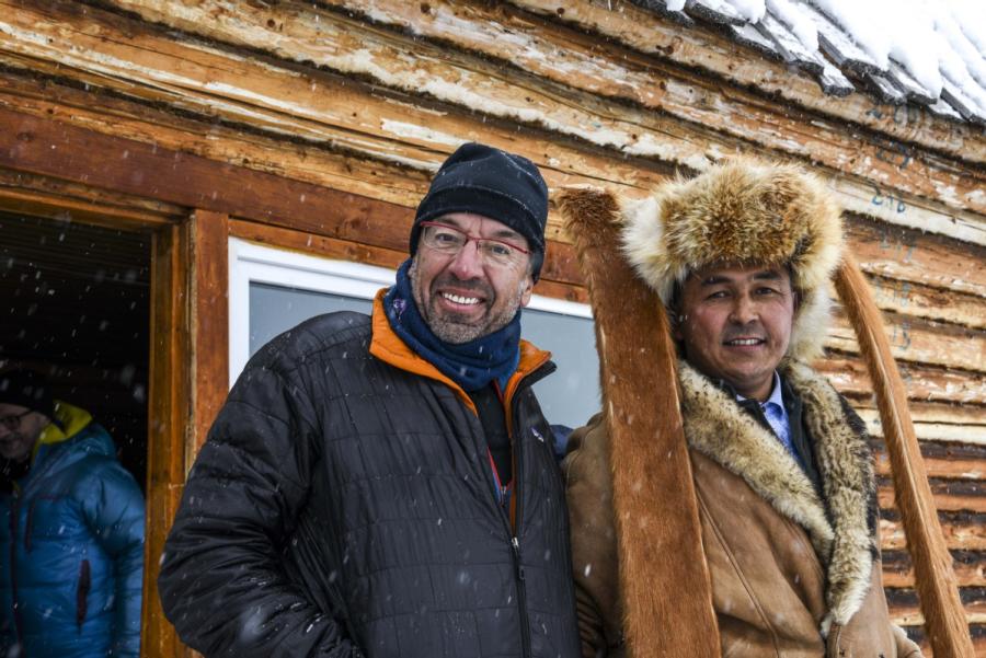Bruno (left) and Mirbek (right) holding a pair of ancient fur skis. (Photo/Xinhua)