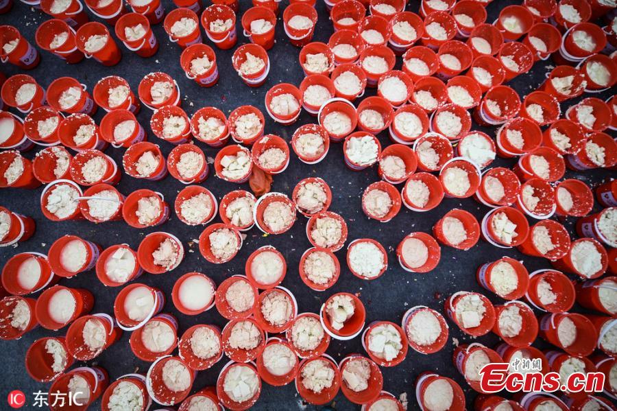 People celebrate a tofu festival in Shegangxia Village in Gaogang Town, South China\'s Guangdong Province, Feb. 17, 2019. The folk festival is a tradition started 400 years ago among local Lin families to worship ancestors and mark the Lantern Festival. Now it has been listed as an intangible cultural heritage, attracting approximately 10,000 people, including many tourists, to join the celebration. (Photo/IC)