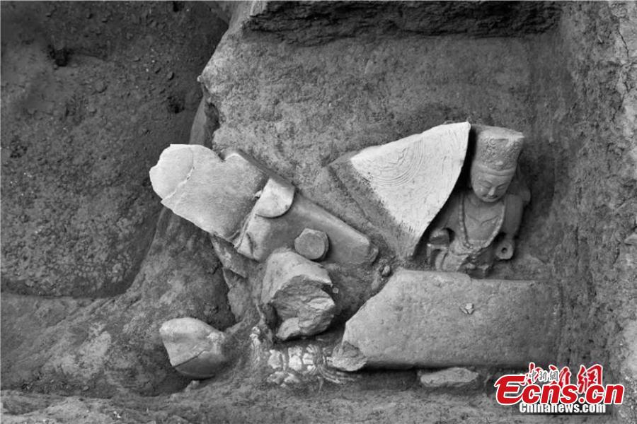 This photo provided by the Shanxi Provincial Institute of Archaeology on Feb. 20, 2019 shows a pit filled with Buddha statues discovered in Xizhou City, Shanxi Province, close to the sacred Buddhist mountain Wutai. The institute said a total of 34 Buddha statues, made in the period from the Northern Wei Dynasty (386-534) to the Tang Dynasty (1368-1644), have been found during six years of excavation work. Archeologists said the statues were possibly buried during the Tang Dynasty, when there was a crackdown on Buddhism. (Photo provided to China News Service)