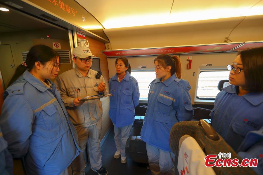 Instructor Yang Shen talks to technicians during a drill simulating a mechanical failure on a high-speed train in Taiyuan, North China’s Shanxi Province, Feb. 21, 2019. The team at the high-speed train service station in Taiyuan, established on March 8, 2018, is comprised of 19 female technicians with an average age of 23 years, the first its kind in China. They are responsible for emergency responses related to high-speed trains heading to Beijing. (Photo: China News Service/Zhang Yun)