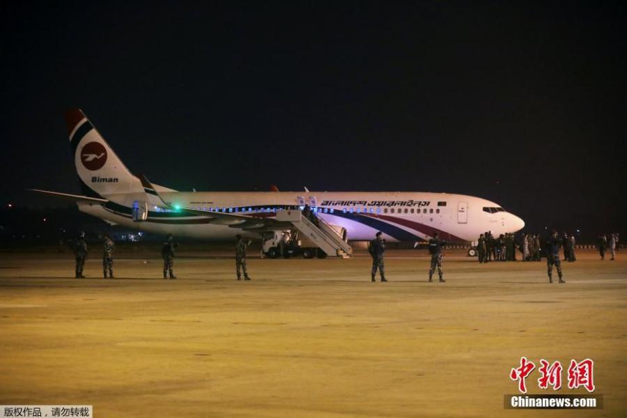 Security personnel stand guard outside of the hijacked aircraft of the Biman Bangladesh Airlines in the Shah Amanat International Airport in Chattogram, Bangladesh, Feb. 24, 2019. (Photo/Agencies)