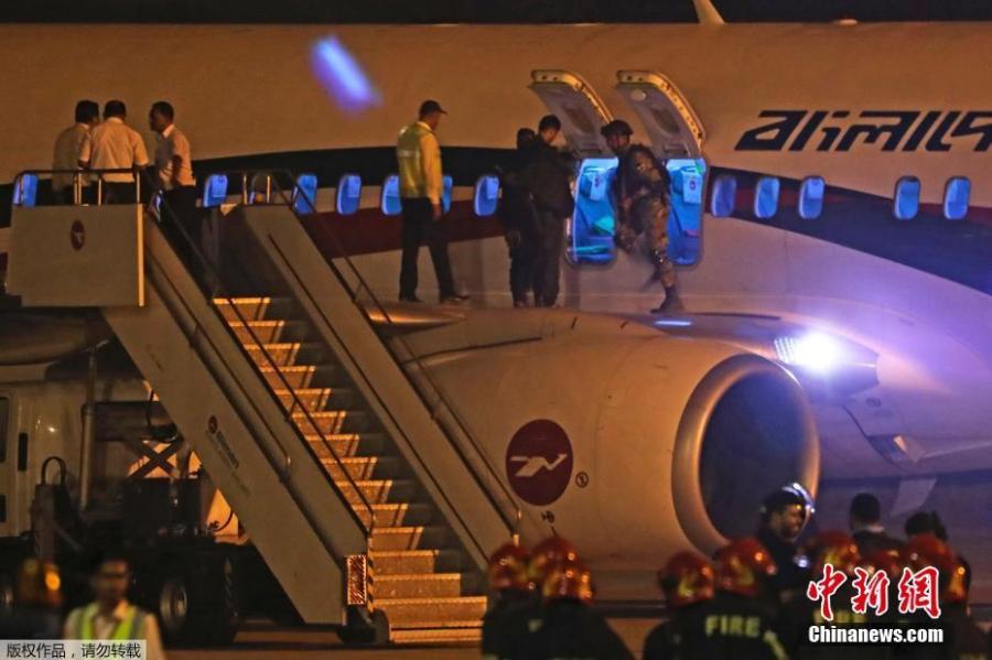 Security personnel check the hijacked aircraft of the Biman Bangladesh Airlines in the Shah Amanat International Airport in Chattogram, Bangladesh, Feb. 24, 2019. (Photo/Agencies)