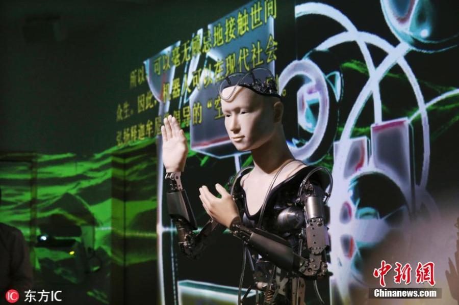 A robot modeled after Kannon Bodhisattva and designed to explain the teachings of Buddha in plain terms is unveiled to the media at Kodaiji Temple in the city of Kyoto, Japan, Feb. 23, 2019. The robot — named Mindar — gave a speech on the Heart Sutra and humanity with English and Chinese subtitles projected on a wall as music played in the background. (Photo/IC)