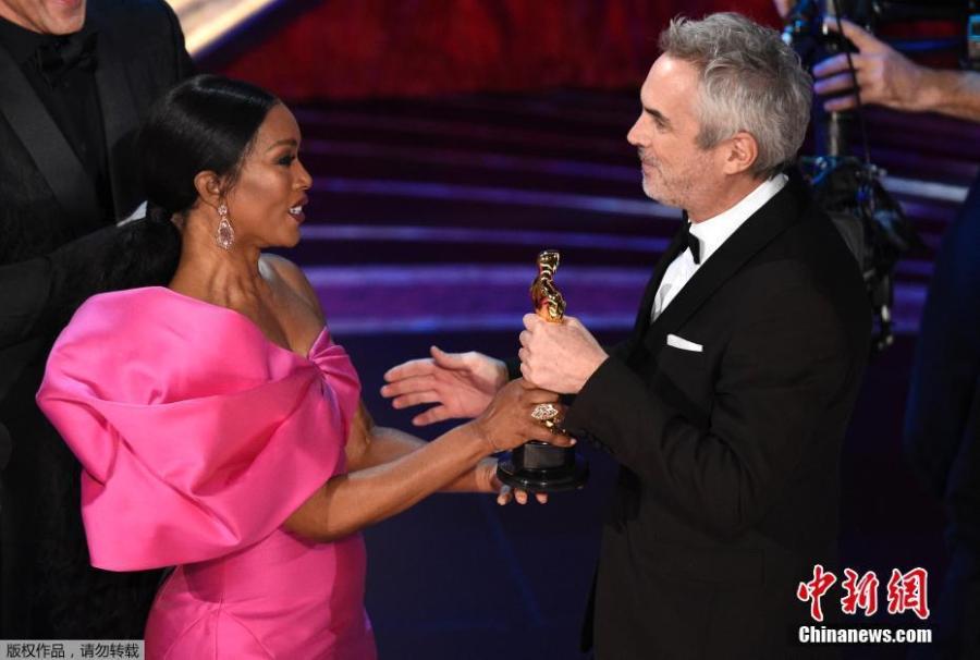 Alfonso Cuaron accepts the Foreign Language Film award for \