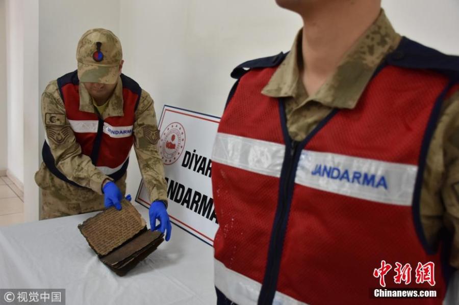 An 800-year-old Hebrew book seized in an anti-smuggling operation is on display in Diyarbakir, Turkey, Feb. 28, 2019. Police detained four suspects trying to illegally sell the book. Filled with Hebrew scripts, the leather book of some 22 pages is believed to contain religious texts. (Photo/VCG)