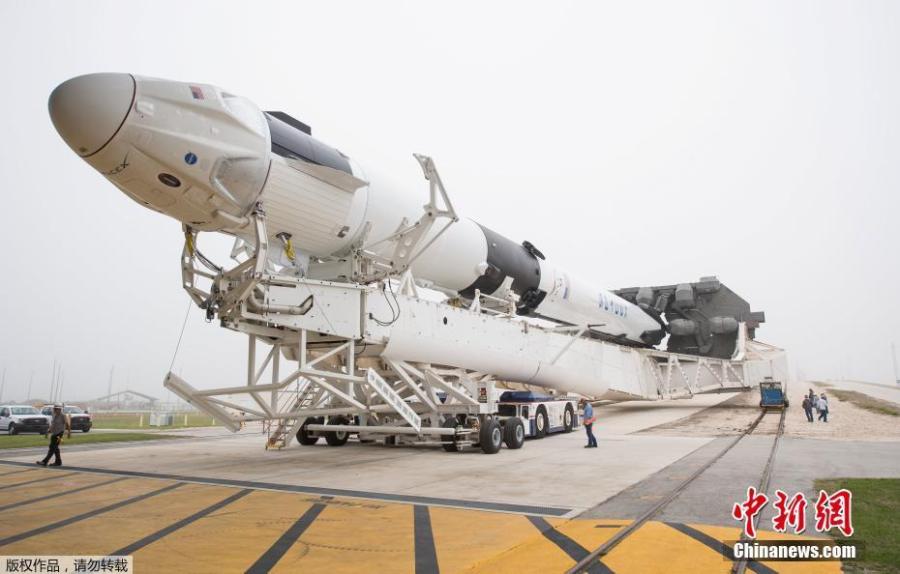 A SpaceX Falcon 9 rocket with the company\'s Crew Dragon spacecraft onboard is seen as it is rolled to the launch pad at Launch Complex 39A as preparations continue for the Demo-1 mission, Feb. 28, 2019 at NASA\'s Kennedy Space Center in Florida. The Demo-1 mission will be the first launch of a commercially built and operated American spacecraft and space system designed for humans as part of NASA\'s Commercial Crew Program. (Photo/Agencies)