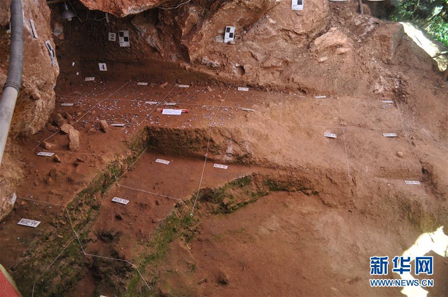 An excavation at the Longquan Cave, an early Upper Paleolithic site in Central China\'s Henan Province. Archeologists have found remains of ash and fire pits in the cave, evidence of the use of fires some 40,000 years ago. The discovery was selected as a top archaeological finding in 2018 in the province. (Photo/Xinhua)