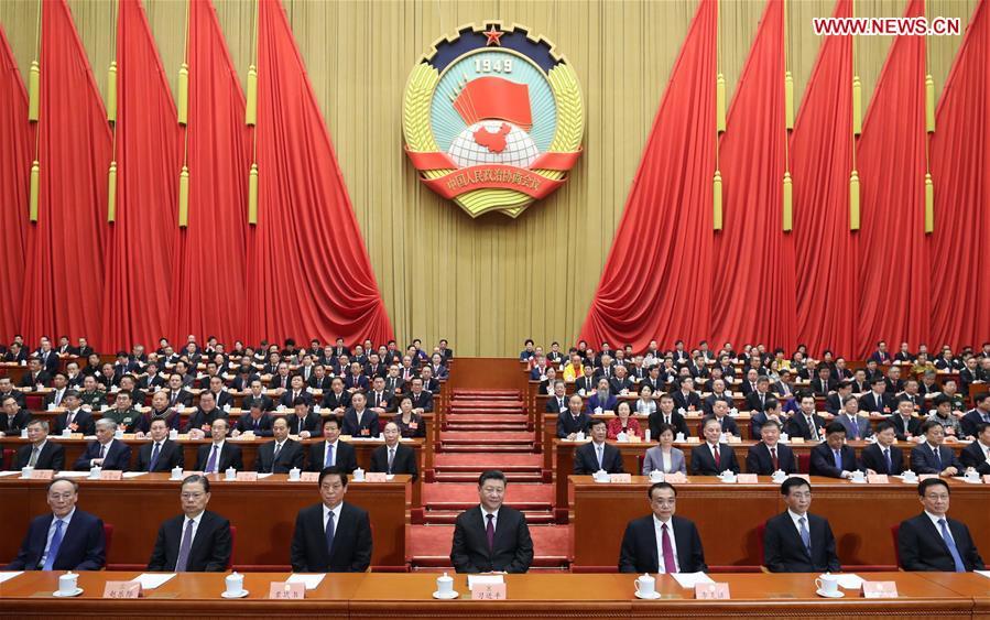 Xi Jinping (C, front), Li Keqiang (3rd R, front), Li Zhanshu (3rd L, front), Wang Huning (2nd R, front), Zhao Leji (2nd L, front), Han Zheng (1st R, front), and Wang Qishan (1st L, front) attend the opening meeting of the second session of the 13th National Committee of the Chinese People\'s Political Consultative Conference at the Great Hall of the People in Beijing, capital of China, March 3, 2019. (Xinhua/Ju Peng)