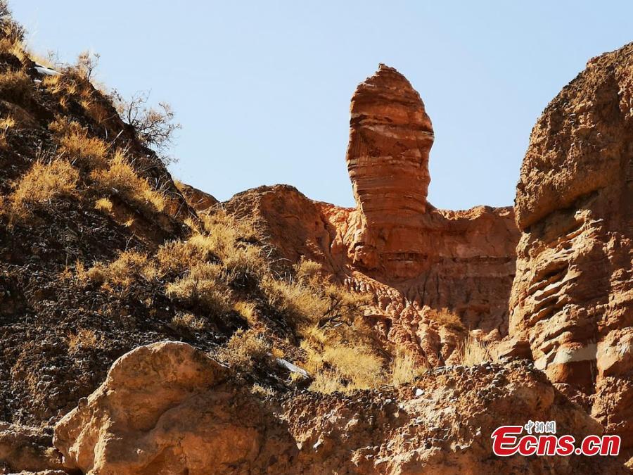 The Binggou Danxia landform in Sunan Yugur Autonomous County, Northwest China\'s Gansu Province. The Danxia landform is a unique type of geomorphology formed from red-colored sandstone and characterized by steep cliffs. The Danxia landform in the Binggou (glacial gully) scenic area is particularly known for its magnificence and strange shapes. (Photo: China News Service/Wu Xuezhen)