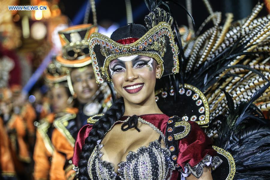 A reveller from a samba school performs during the carnival parade in Sao Paulo, Brazil, March 3, 2019. (Xinhua/Rahel Patrasso)