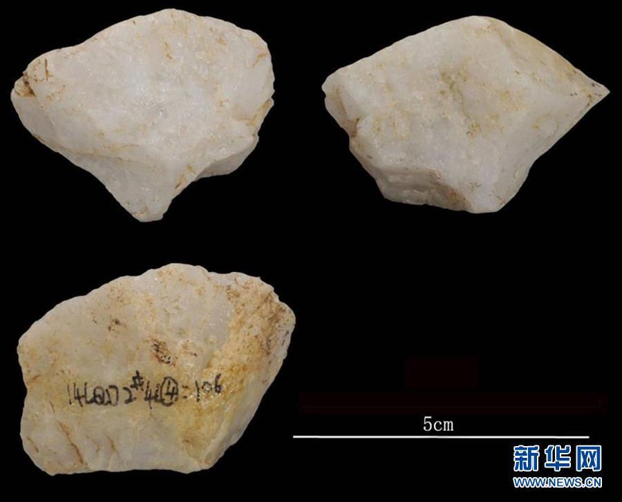 Stone relics excavated at the Longquan Cave, an early Upper Paleolithic site in Central China\'s Henan Province. Archeologists have found remains of ash and fire pits in the cave, evidence of the use of fires some 40,000 years ago. The discovery was selected as a top archaeological finding in 2018 in the province. (Photo/Xinhua)