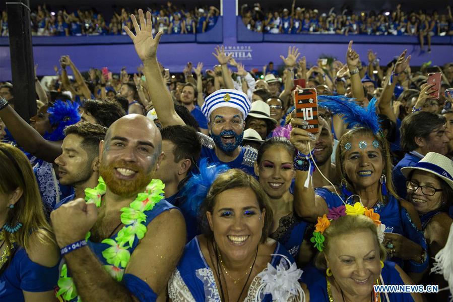 The audience react during the parades of the Rio Carnival 2019 at the Sambadrome in Rio de Janeiro, Brazil, on March 5, 2019. The parade of the special group samba school concluded on Tuesday. (Xinhua/Li Ming)