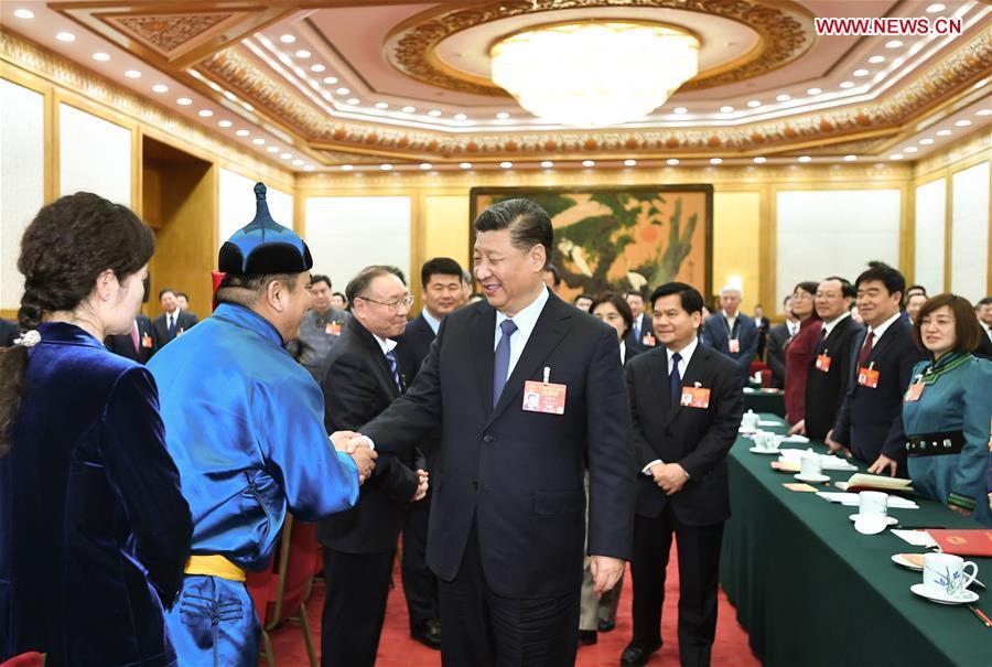 Chinese President Xi Jinping, also general secretary of the Communist Party of China (CPC) Central Committee and chairman of the Central Military Commission, attends a panel discussion with his fellow deputies from Inner Mongolia Autonomous Region at the second session of the 13th National People\'s Congress in Beijing, capital of China, March 5, 2019. (Xinhua/Xie Huanchi)