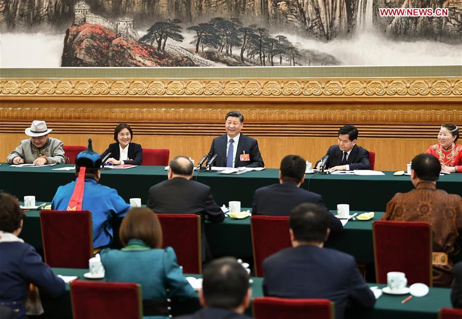 Chinese President Xi Jinping, also general secretary of the Communist Party of China (CPC) Central Committee and chairman of the Central Military Commission, attends a panel discussion with his fellow deputies from Inner Mongolia Autonomous Region at the second session of the 13th National People\'s Congress in Beijing, capital of China, March 5, 2019. (Xinhua/Xie Huanchi)