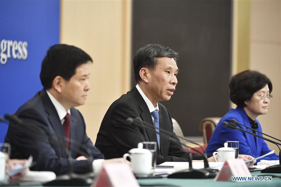 China\'s Minister of Finance Liu Kun (C) answers questions at a press conference on the country\'s fiscal and tax reforms and fiscal work for the second session of the 13th National People\'s Congress in Beijing, capital of China, March 7, 2019. (Xinhua/Li Ran)