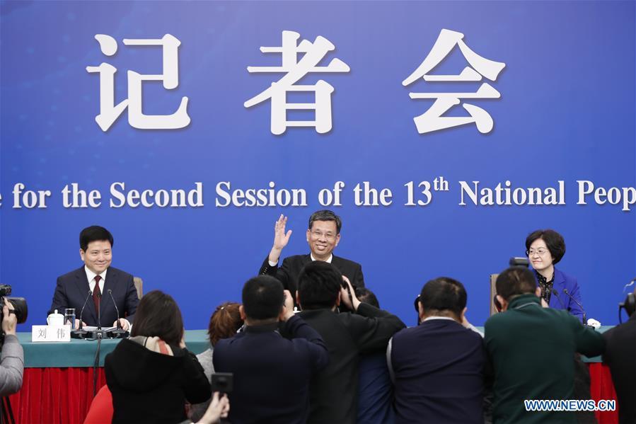 China\'s Minister of Finance Liu Kun (C), and vice ministers Cheng Lihua (R) and Liu Wei attend a press conference on the country\'s fiscal and tax reforms and fiscal work for the second session of the 13th National People\'s Congress in Beijing, capital of China, March 7, 2019. (Xinhua/Shen Bohan)