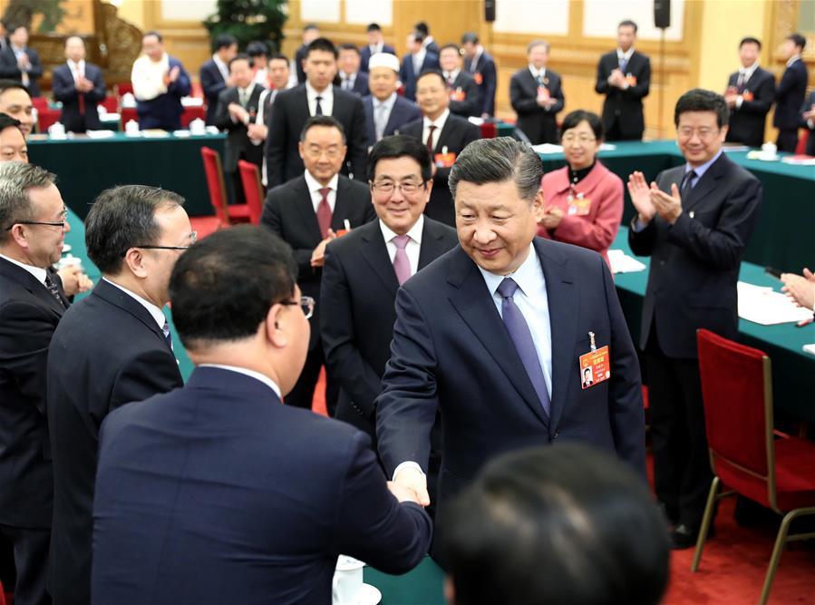 Chinese President Xi Jinping, also general secretary of the Communist Party of China (CPC) Central Committee and chairman of the Central Military Commission, joins deliberation with deputies from Gansu Province at the second session of the 13th National People\'s Congress in Beijing, capital of China, March 7, 2019. (Xinhua/Ju Peng)
