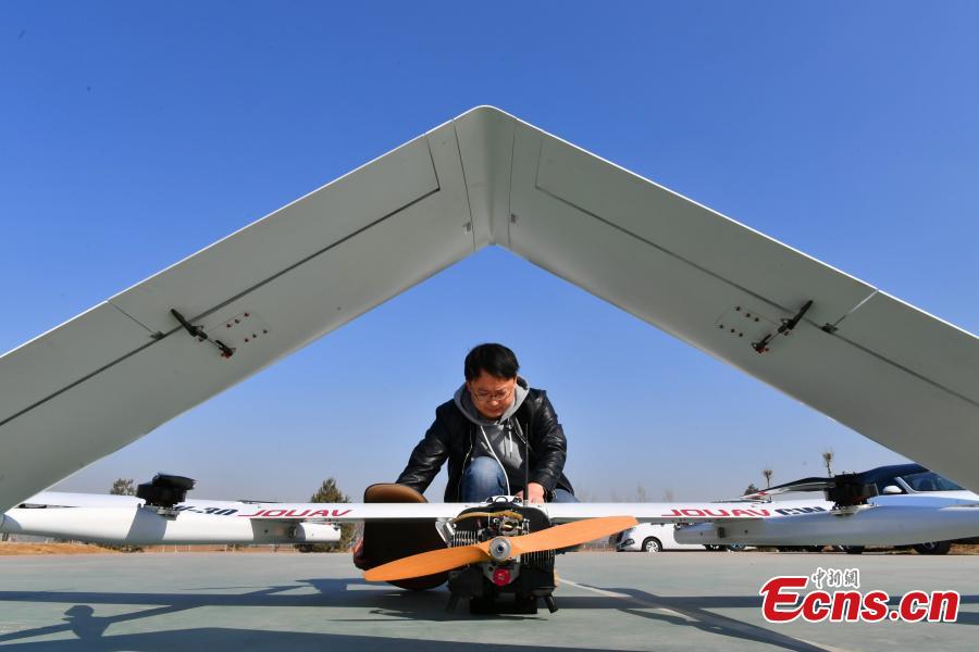 A drone put into use by Chengguan, urban management officers, in Shijiazhuang City, Hebei Province, March 7, 2019. The drone, with a wingspan of four meters, is used to take aerial photos of an area 138 square kilometres in size, to aid Chengguan in spotting open-air garbage and unapproved construction. (Photo: China News Service/Zhai Yujia)