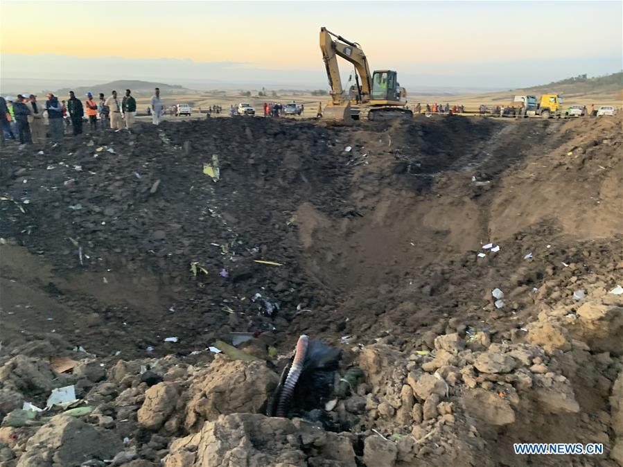 An excavator works at the crash site of an Ethiopian Airlines\' aircraft, some 50 km east of Addis Ababa, capital of Ethiopia, on March 10, 2019. All 157 people aboard Ethiopian Airlines flight were confirmed dead as Africa\'s fastest growing airline witnessed the worst-ever incident in its history. The incident on Sunday, which involved a Boeing 737-800 MAX, occurred a few minutes after the aircraft took off from Addis Ababa Bole International Airport to Nairobi, Kenya. It crashed around Bishoftu town, the airline said. (Xinhua/Wang Shoubao)