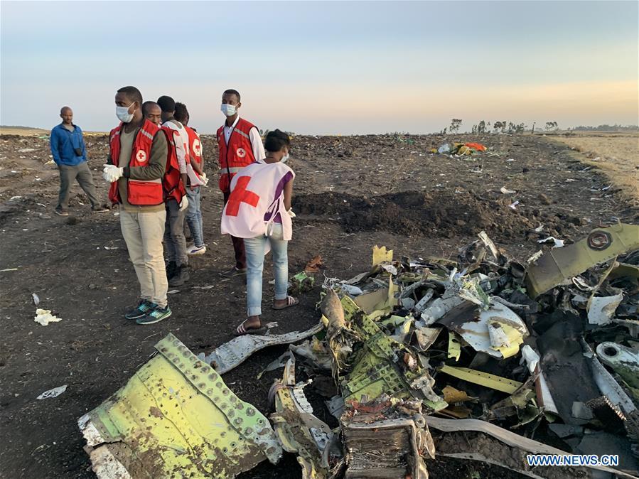 Rescuers work beside the wreckage of an Ethiopian Airlines\' aircraft at the crash site, some 50 km east of Addis Ababa, capital of Ethiopia, on March 10, 2019. All 157 people aboard Ethiopian Airlines flight were confirmed dead as Africa\'s fastest growing airline witnessed the worst-ever incident in its history. The incident on Sunday, which involved a Boeing 737-800 MAX, occurred a few minutes after the aircraft took off from Addis Ababa Bole International Airport to Nairobi, Kenya. It crashed around Bishoftu town, the airline said. (Xinhua/Wang Shoubao)
