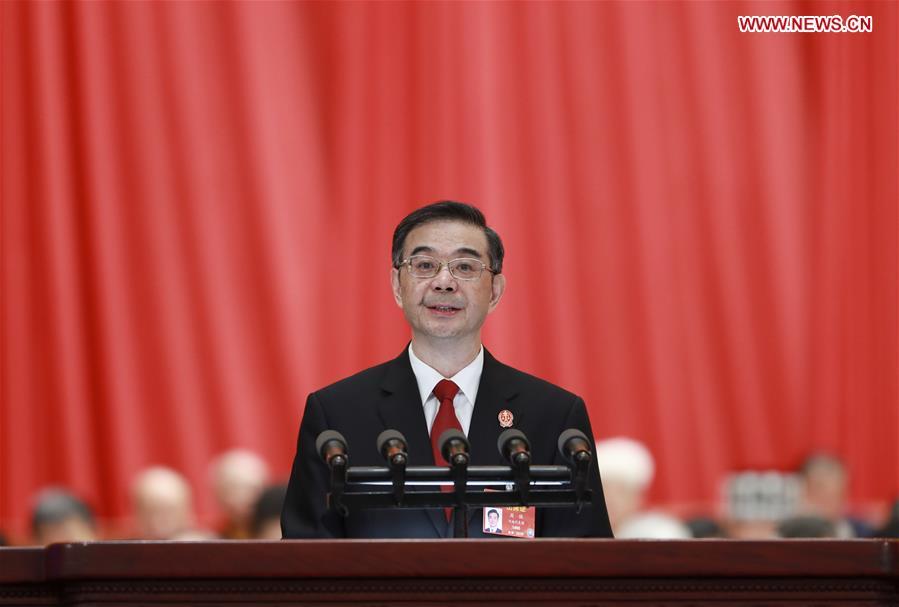 Chief Justice Zhou Qiang delivers a work report of the Supreme People\'s Court (SPC) at the third plenary meeting of the second session of the 13th National People\'s Congress (NPC) at the Great Hall of the People in Beijing, capital of China, March 12, 2019. (Xinhua/Pang Xinglei)