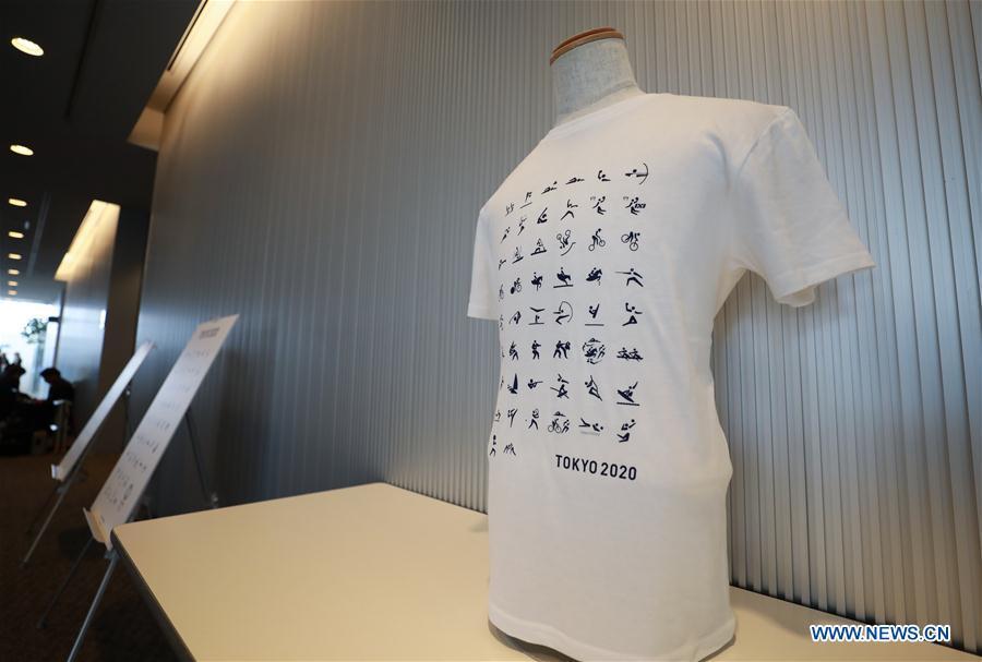 A T-shirt with sport pictograms of the Tokyo 2020 Summer Olympic Games is displayed at the unveiling event in Tokyo, Japan, on March 12, 2019. (Xinhua/Du Xiaoyi)