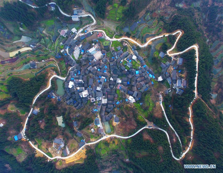 Aerial Photo taken on March 12, 2019 shows the winding concrete road at Donglong Village of Gedong Township in Jianhe County, Miao and Dong Autonomous Prefecture of Qiandongnan, southwest China\'s Guizhou Province. The concrete road project in Guizhou was launched in August, 2017. Up to now, Guizhou has seen 77,700 kilometers of rural roads built or renovated with nearly 40,000 villages connected by concrete roads. Tens of millions of rural people benefit from the project. (Xinhua/Fang Peng)