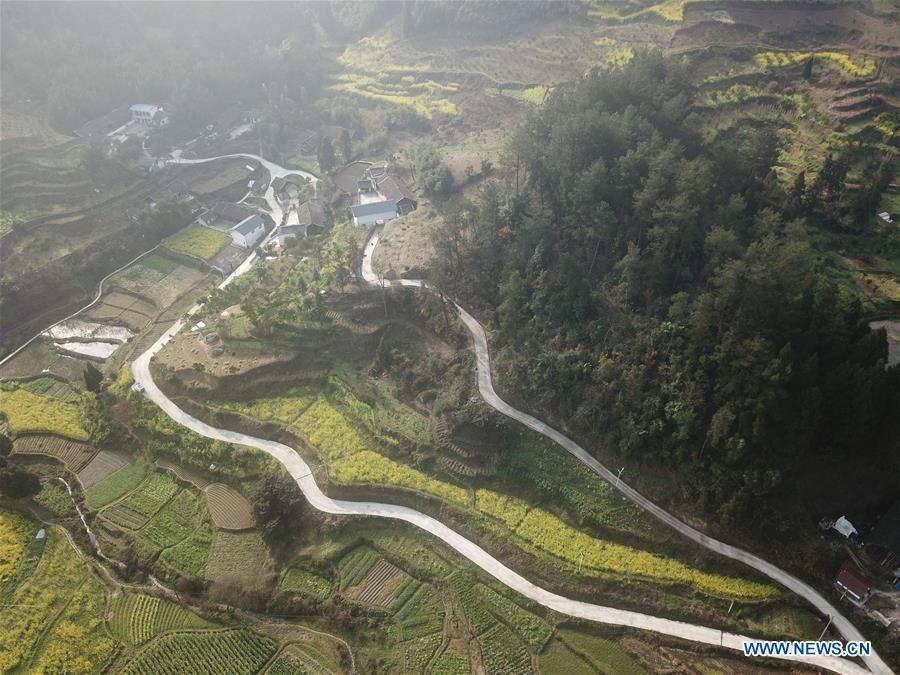 Aerial Photo taken on March 12, 2019 shows the winding concrete road at Kuilong Village of Baini Township in Yuqing County, Zunyi City, southwest China\'s Guizhou Province. The concrete road project in Guizhou was launched in August, 2017. Up to now, Guizhou has seen 77,700 kilometers of rural roads built or renovated with nearly 40,000 villages connected by concrete roads. Tens of millions of rural people benefit from the project. (Xinhua/He Chunyu)