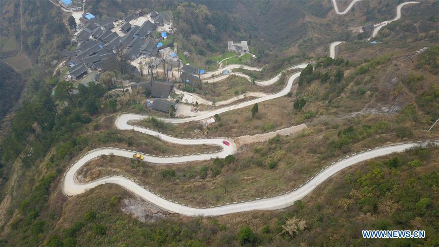 Aerial Photo taken on March 12, 2019 shows the winding concrete road at Longjiang Village of Xuanwei Township in Majiang County, Miao and Dong Autonomous Prefecture of Qiandongnan, southwest China\'s Guizhou Province. The concrete road project in Guizhou was launched in August, 2017. Up to now, Guizhou has seen 77,700 kilometers of rural roads built or renovated with nearly 40,000 villages connected concrete roads. Tens of millions of rural people benefit from the project. (Xinhua/Cai Xingwen)