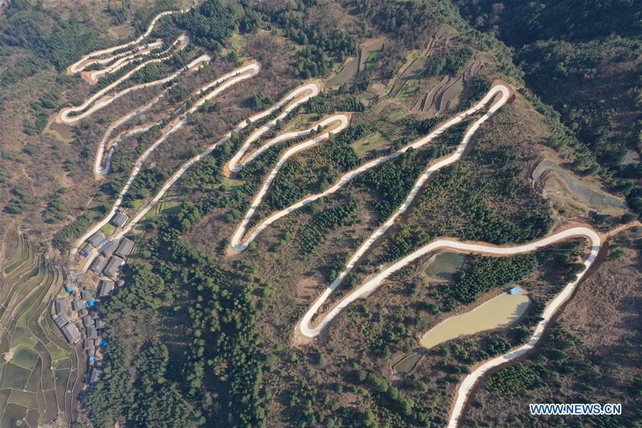 Aerial Photo taken on March 11, 2019 shows the winding concrete road at Jiame Village of Gangbian Township in Congjiang County, Miao and Dong Autonomous Prefecture of Qiandongnan, southwest China\'s Guizhou Province. The concrete road project in Guizhou was launched in August, 2017. Up to now, Guizhou has seen 77,700 kilometers of rural roads built or renovated with nearly 40,000 villages connected by concrete roads. Tens of millions of rural people benefit from the project. (Xinhua/Luo Jinglai)