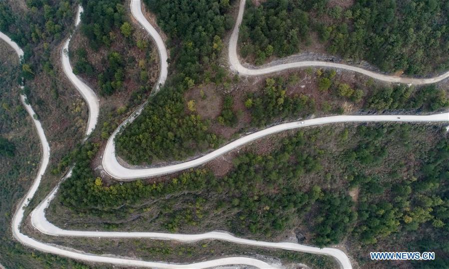Aerial Photo taken on March 12, 2019 show the winding concrete road at Lianhua Village of Longshan Township in Longli County, Bouyei-Miao Autonomous Prefecture of Qiannan, southwest China\'s Guizhou Province. The concrete road project in Guizhou was launched in August, 2017. Up to now, Guizhou has seen 77,700 kilometers of rural roads built or renovated with nearly 40,000 villages connected by concrete roads. Tens of millions of rural people benefit from the project. (Xinhua/Long Yi)