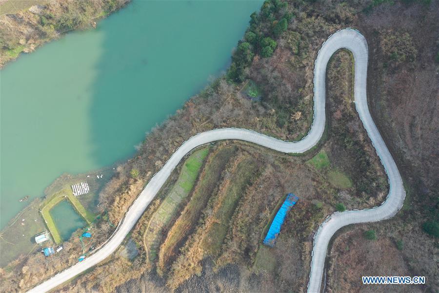 Aerial Photo taken on March 12, 2019 shows the winding concrete road at Wengnong Village of Laotun Township in Taijiang County, Miao and Dong Autonomous Prefecture of Qiandongnan, southwest China\'s Guizhou Province. The concrete road project in Guizhou was launched in August, 2017. Up to now, Guizhou has seen 77,700 kilometers of rural roads built or renovated with nearly 40,000 villages connected by concrete roads. Tens of millions of rural people benefit from the project. (Xinhua/Ouyang Guanglin)