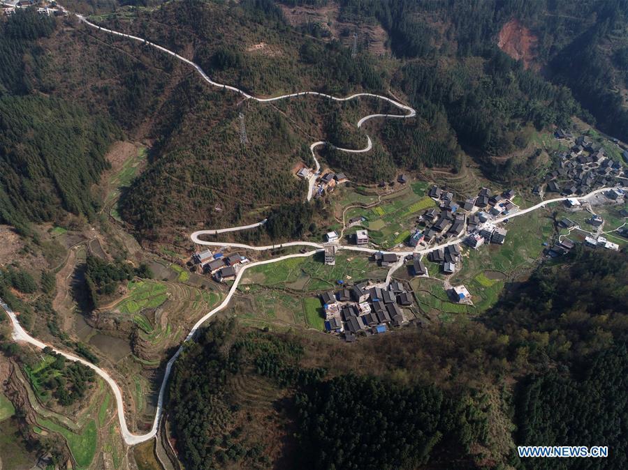 Aerial Photo taken on March 11, 2019 shows the winding concrete road at Zaigao Village of Guzhou Township in Rongjiang County, Miao and Dong Autonomous Prefecture of Qiandongnan, southwest China\'s Guizhou Province. The concrete road project in Guizhou was launched in August, 2017. Up to now, Guizhou has seen 77,700 kilometers of rural roads built or renovated with nearly 40,000 villages connected by concrete roads. Tens of millions of rural people benefit from the project.(Xinhua/Wu Dechang)